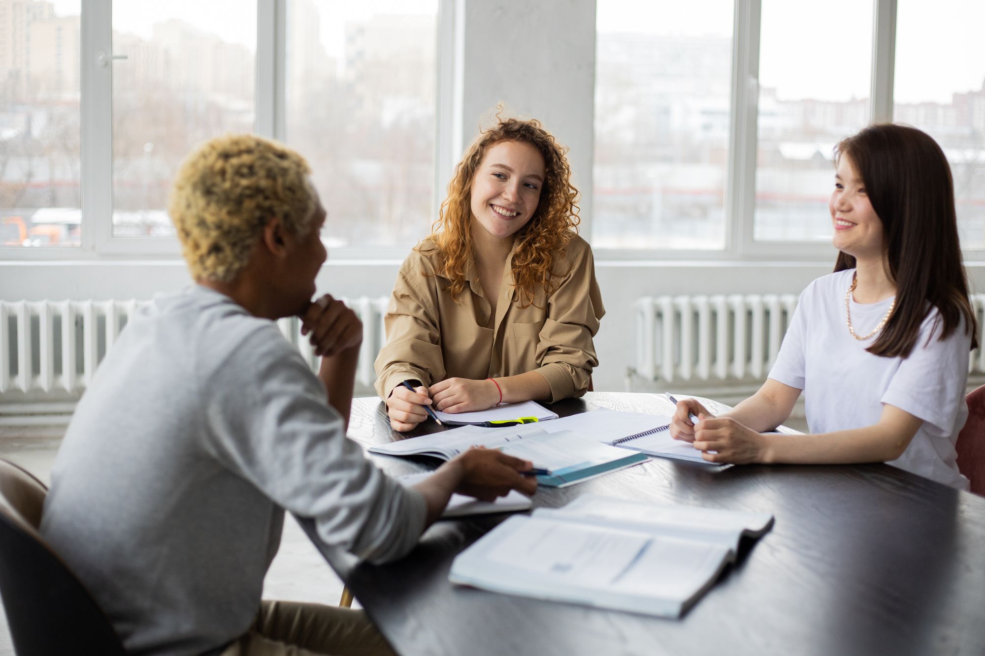 Students sharing ideas around a table