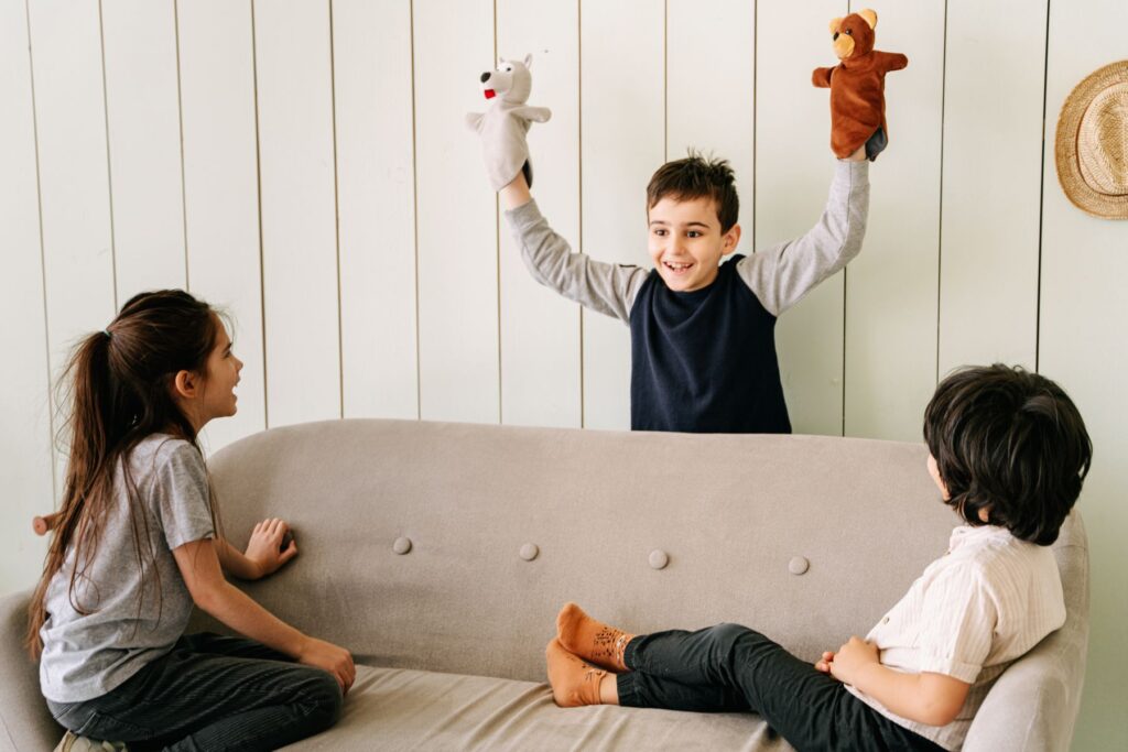 Children telling stories with hand puppets